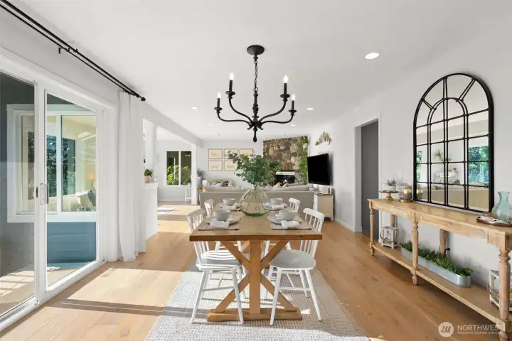 The kitchen flows seamlessly into the dining area that opens up to the main floor deck and continues into the living room area.