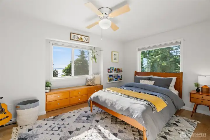 The third bedroom upstairs offers an elevated view, similar to the primary bedroom.