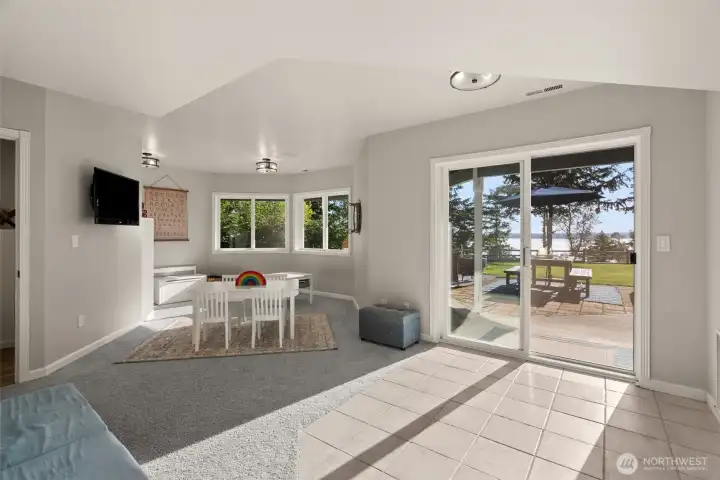 Downstairs offers a large bonus room and opens to the patio and connects with the attached two car garage.