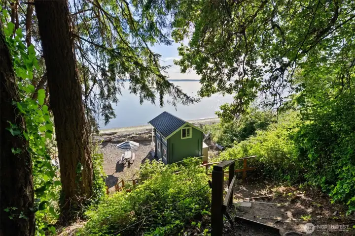 Coming down from the house, and entirely within the same parcel, are custom built stairs and path that take you right to your very own private, usable beach.
