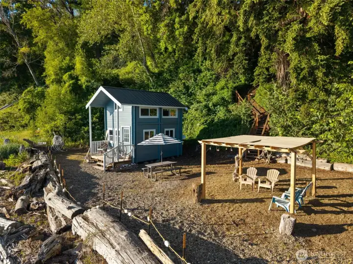 The 93 feet of waterfront features a functional beachside retreat - complete with a comfortable structure and room to spread out.