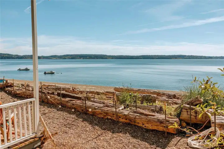 Sitting on the front porch of the beachside structure is one of several places to sit and relax.