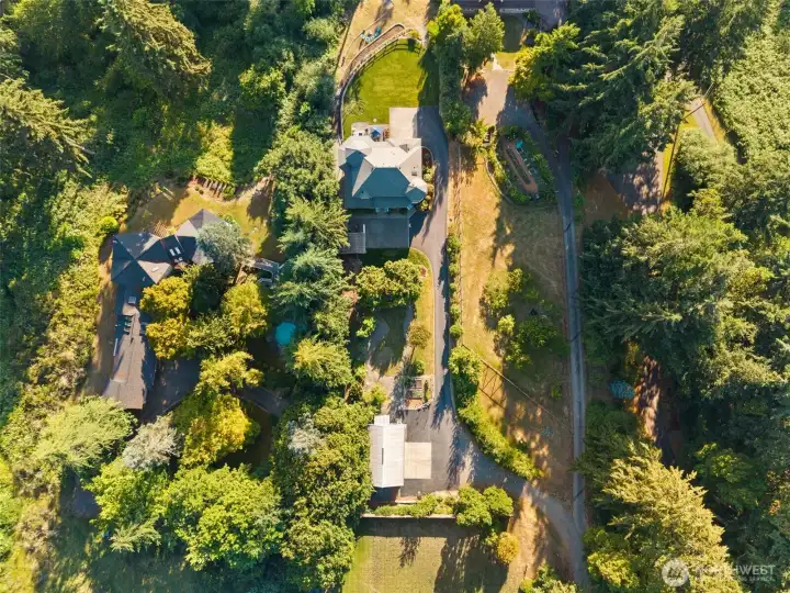 From the large detached garage, garden space, chicken coop, expansive lawn, decks, trails - there is so much to see here, we hope you come see it in person.
