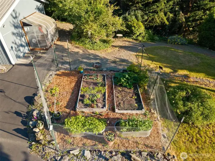 The large garden is prepped and ready to grow all your summer favorites, just steps away from your front door.