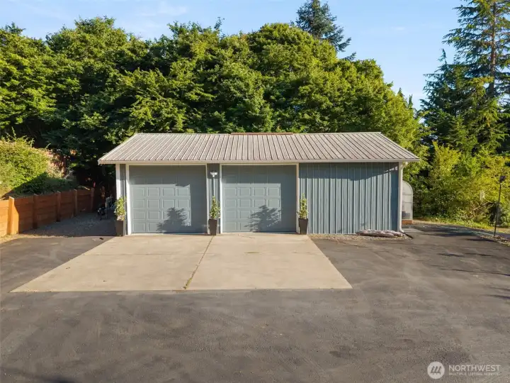 The 865 sq ft detached garage features its own power and water meter, tons of storage, and plenty of parking in the driveway and more room on the sides.
