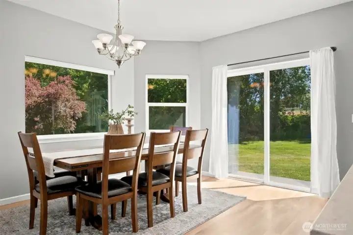 Light-filled dining area with backyard views and outdoor access Light-filled dining area with backyard views and outdoor access