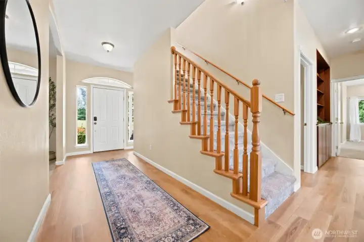 Welcoming entry with hardwood floors and staircase to the upper level. Welcoming entry with hardwood floors and staircase to the upper level.