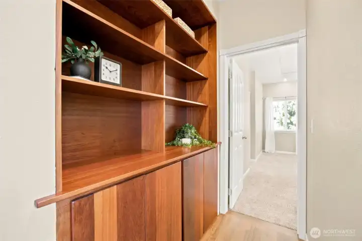 Custom built-in cabinetry provides additional storage and display space Custom built-in cabinetry provides additional storage and display space