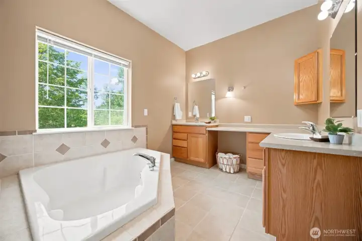Primary bath with dual vanity and soaking tub Primary bath with dual vanity and soaking tub
