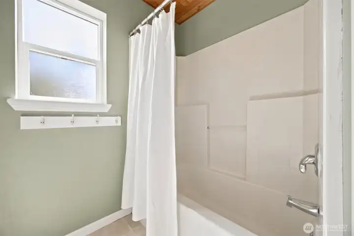 Separate tub and shower area provides added convenience for the upper-level bedrooms Separate tub and shower area provides added convenience for the upper-level bedrooms