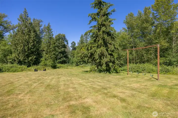 Level, park-like backyard with plenty of room for play, recreation, gardening, or entertaining. Level, park-like backyard with plenty of room for play, recreation, gardening, or entertaining.