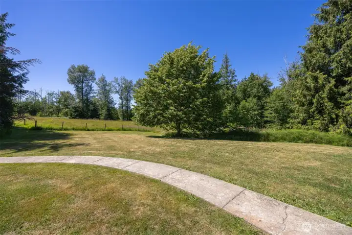 Fenced field provides space for small livestock, hobby farming, gardening, or outdoor recreation. Fenced field provides space for small livestock, hobby farming, gardening, or outdoor recreation.