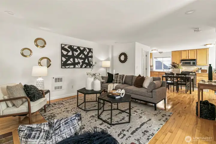 Upstairs is the spacious great room with real hardwood flooring and offering flexible furniture options and room to entertain.