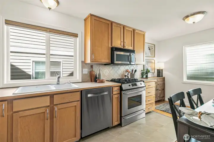 Newer stainless appliances and plenty of work space and storage.