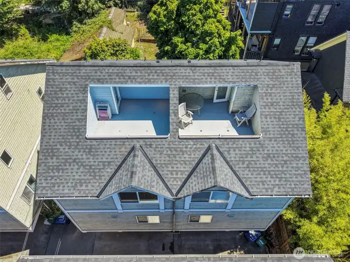 Brand new roof!  Freshly painted rooftop area is ready for summer! (deck on the left in photo)