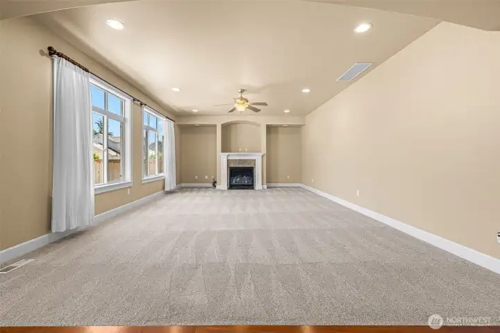 Large living room with gas fireplace and ceiling fan Large living room with gas fireplace and ceiling fan