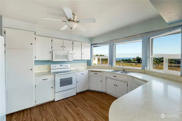 The bright kitchen with plenty of counter and storage space.