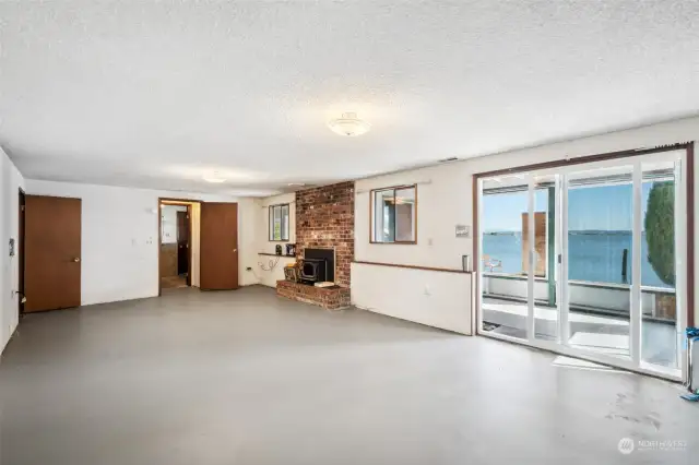 Lower level opens to area under the deck and the beach.