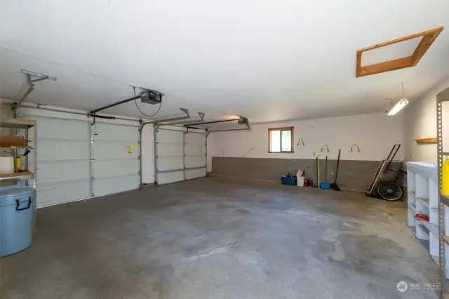 Detached 2 car garage with space for projects.