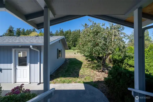 Looking from the covered front porch to the garage door.