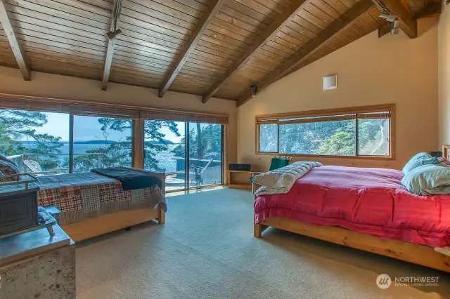 Primary suite features two bathrooms, multiple closets and storage and private deck.