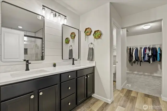 Primary bath was remodeled in May 2022 with new LVP flooring, new shower with floor to ceiling tile surround and soap niche, new glass shower door, quartz countertops, undermount sinks and faucets, New lighting and Mirrors, New linen closet was added and a new exhaust fan with speaker and bluetooth.