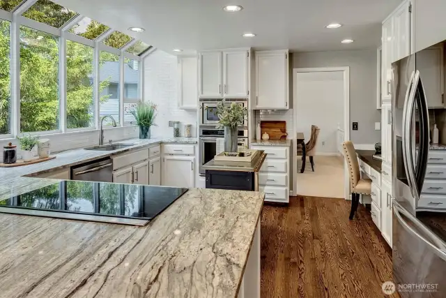 Stainless appliances throughout. Note the massive garden window by the sink. An enjoyable way to do cleanup!