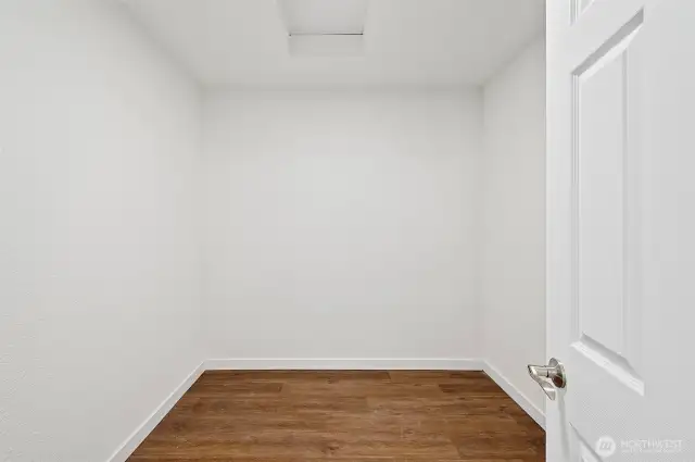 Primary bedroom walk-in closet