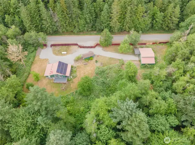 Over head shot of home, circular driveway & Barn