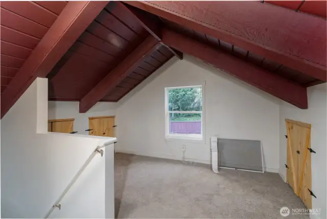 Upstairs vaulted bonus room, great home office area with storage