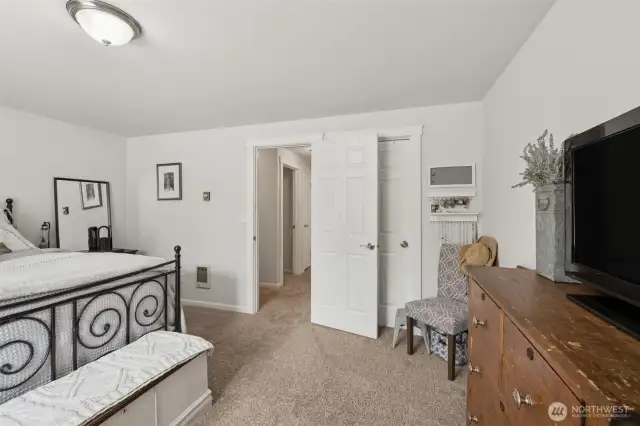 Primary bedroom upstairs with walk-in closet.
