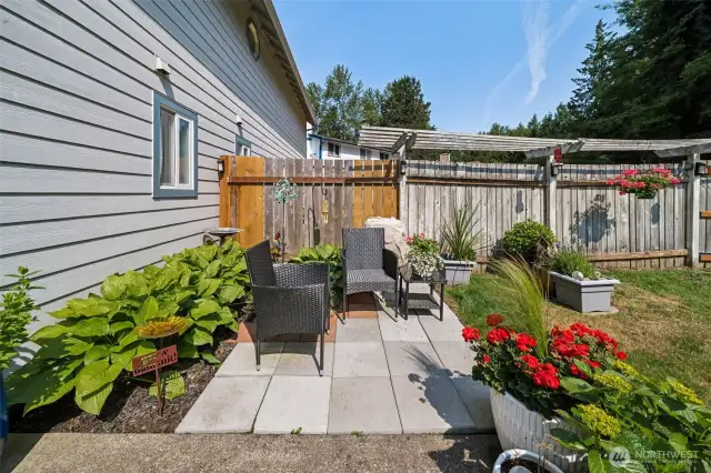 Unwind on the charming patio—perfect for potted flowers, morning coffee, or soaking up the sun.
