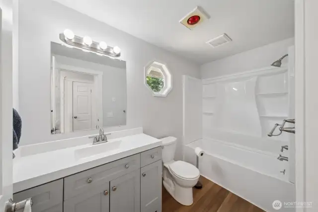 Updated bathroom! New vanity, new LVP flooring & new tub/shower!