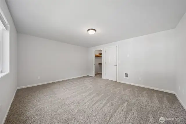 Primary Suite with large walk in closet, new carpet & new paint!