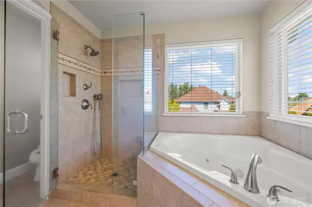 Primary Bedroom includes walk in closet, ensuite 5-piece bathroom w/soaking tub.