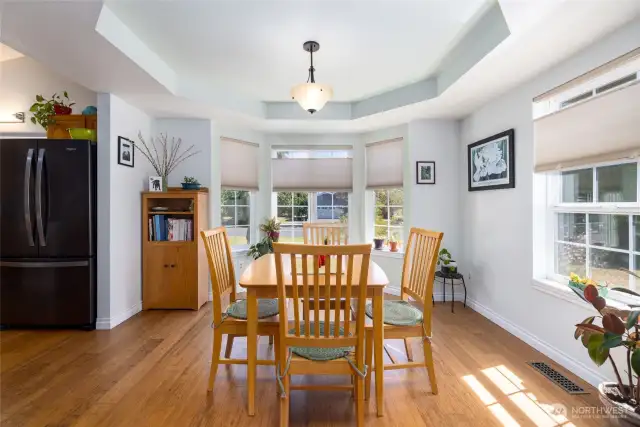 Coffered ceiling in the dining room, bamboo flooring, lots of natural light.