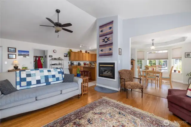 A view of the living room looking toward the kitchen on left and dining room on the right.