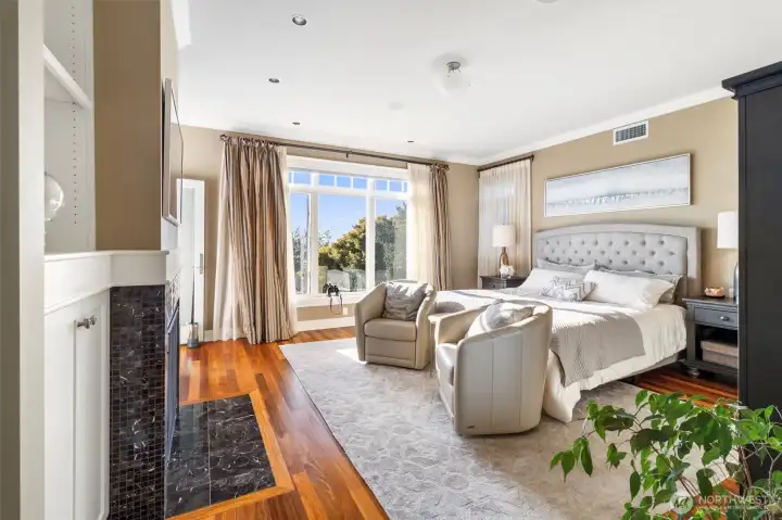 Main Floor Primary with fireplace and EnSuite