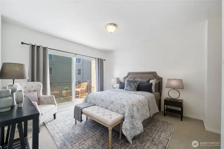 The primary suite also has it's own balcony beyond the large sliding glass door.