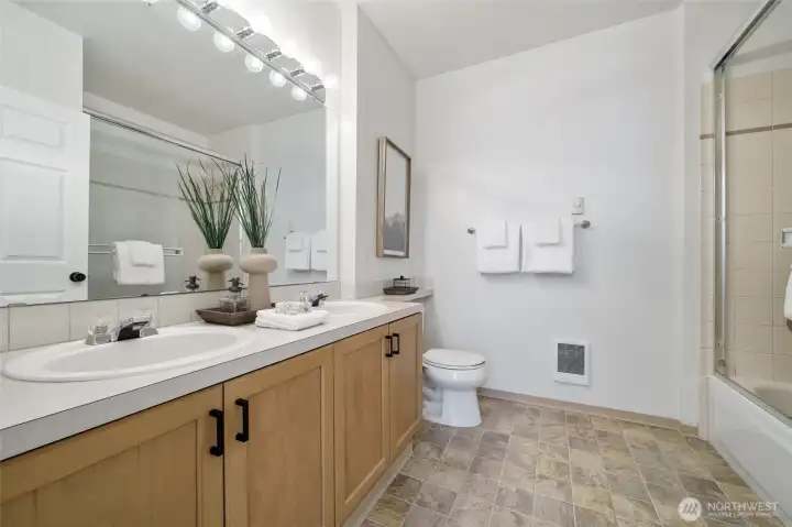Two sinks and plenty of space in this full primary bath.