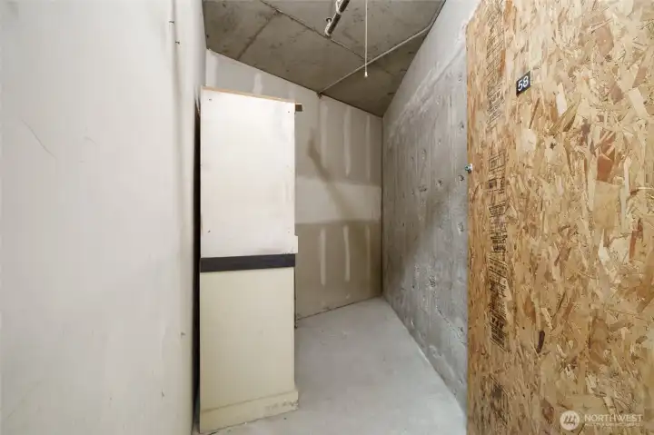 A large storage space in the garage close to 2 of the parking spaces.