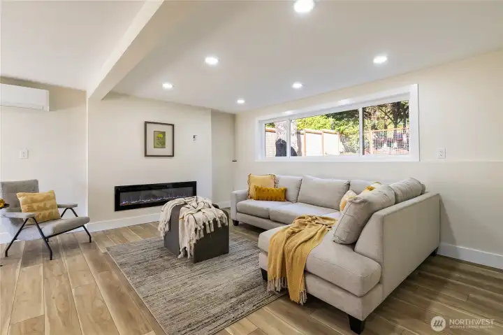 living area downstairs with fireplace