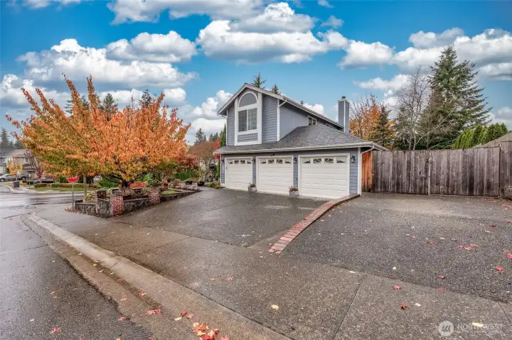 This corner lot brings TONS of advantages. 3-car garage plus LOTS of extra parking and LOTS of storage. YES, that area on the right IS YOURS.