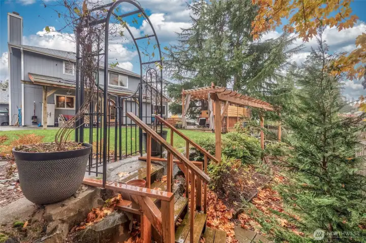 Custom terrace walks down to garden area.