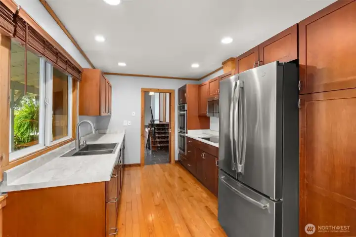 Thoughtfully updated kitchen with modern appliances, new countertops, and plenty of cabinet storage. Designed for both function and style, it’s an ideal space for meal prep, morning coffee, and family dinners.