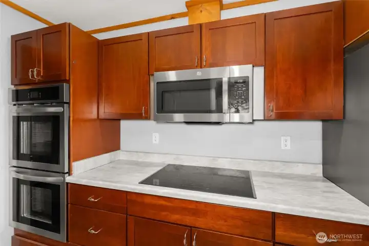 Enjoy the convenience of a built-in microwave and stylish new countertops that brighten the space.