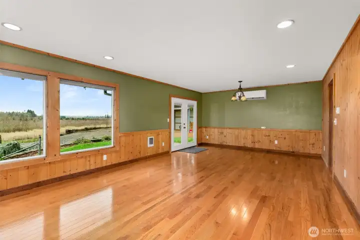 The living and dining spaces feature stunning hardwood floors that bring warmth and elegance, creating a beautiful backdrop for any décor style. Efficient mini-split heat pump keeps the home warm in winter and refreshingly cool in summer.