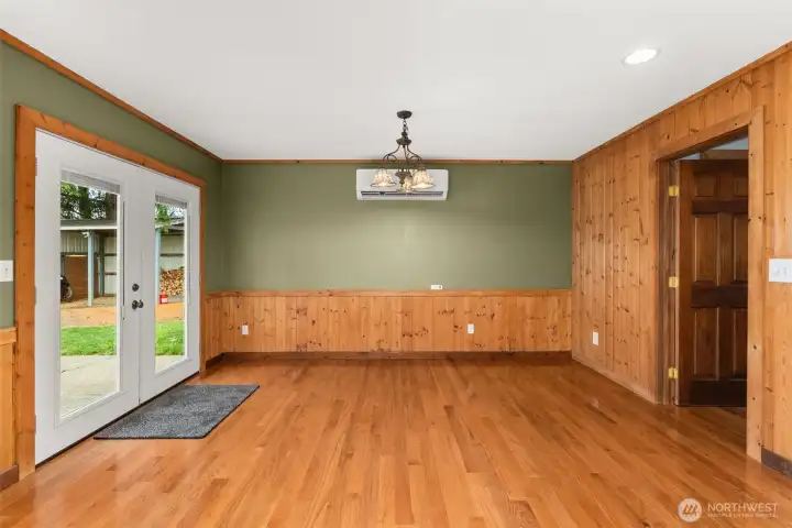 The dining area has french doors that open to the backyard—perfect for indoor-outdoor living, summer barbecues, or enjoying the view of the property.