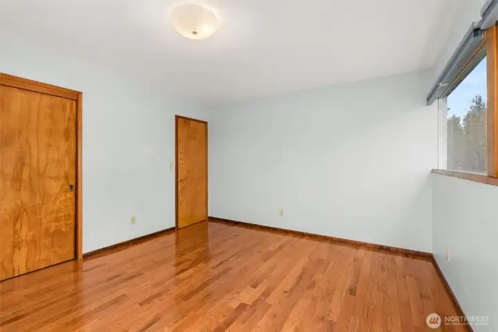 The primary bedroom offers ample closet space, while the upper hall includes built-ins perfect for linens and additional storage needs.