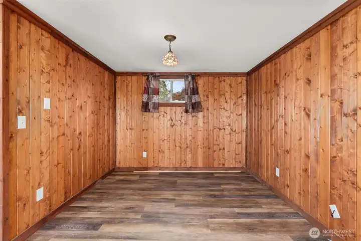 Lower-level living area features a convenient nook that creates an ideal space for a home office or work-from-home setup or even an additional bedroom space.